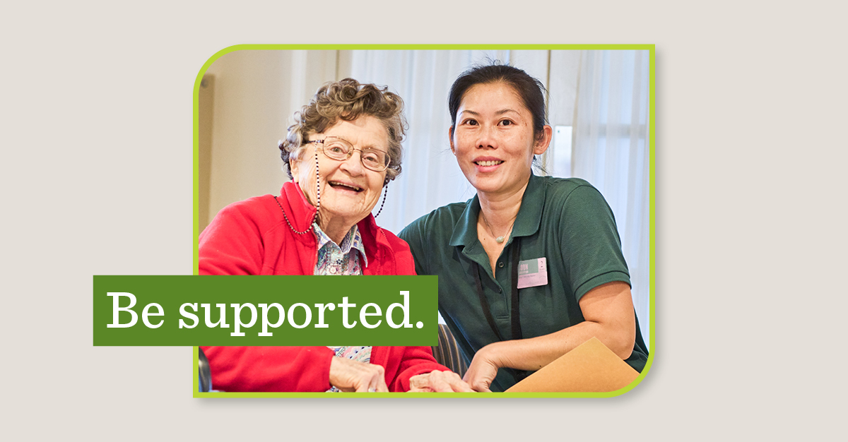 Atria Aquidneck Place staff member Boon Lai Sorrentino photographed with a resident