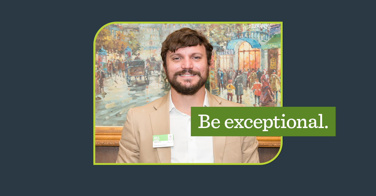 Man in tan jacket smiling and a green overlay with the words 