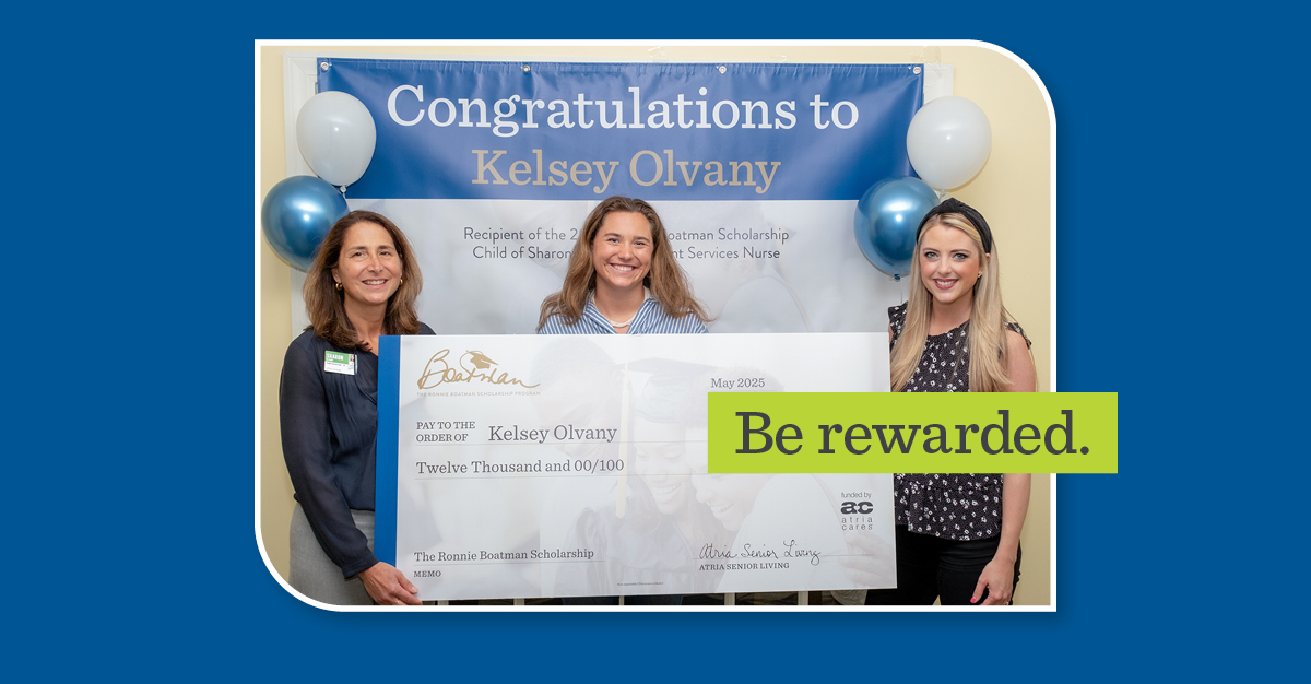 Three women holding an oversized check with a green overlay with the words 